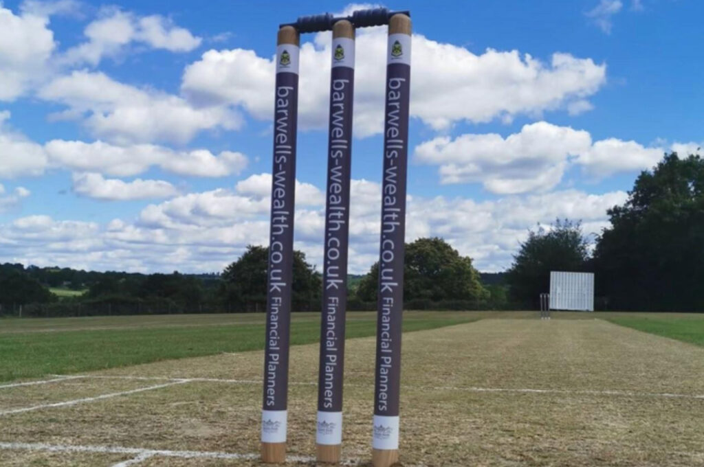 Cricket stumps with the Barwells Wealth website address printed on them. 
