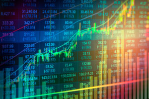 A photo of a screen showing a graph charting stock market returns