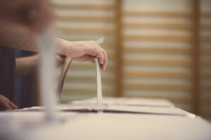 A person casts their vote at a polling station.